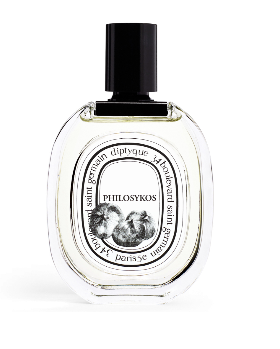 Charakterystyczna butelka perfum Diptyque PHILOSYKOS o owalnym kształcie z ryciną przedstawiającą figi.